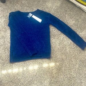 A blue, size medium, tribal, long sleeve crew neck sweater.